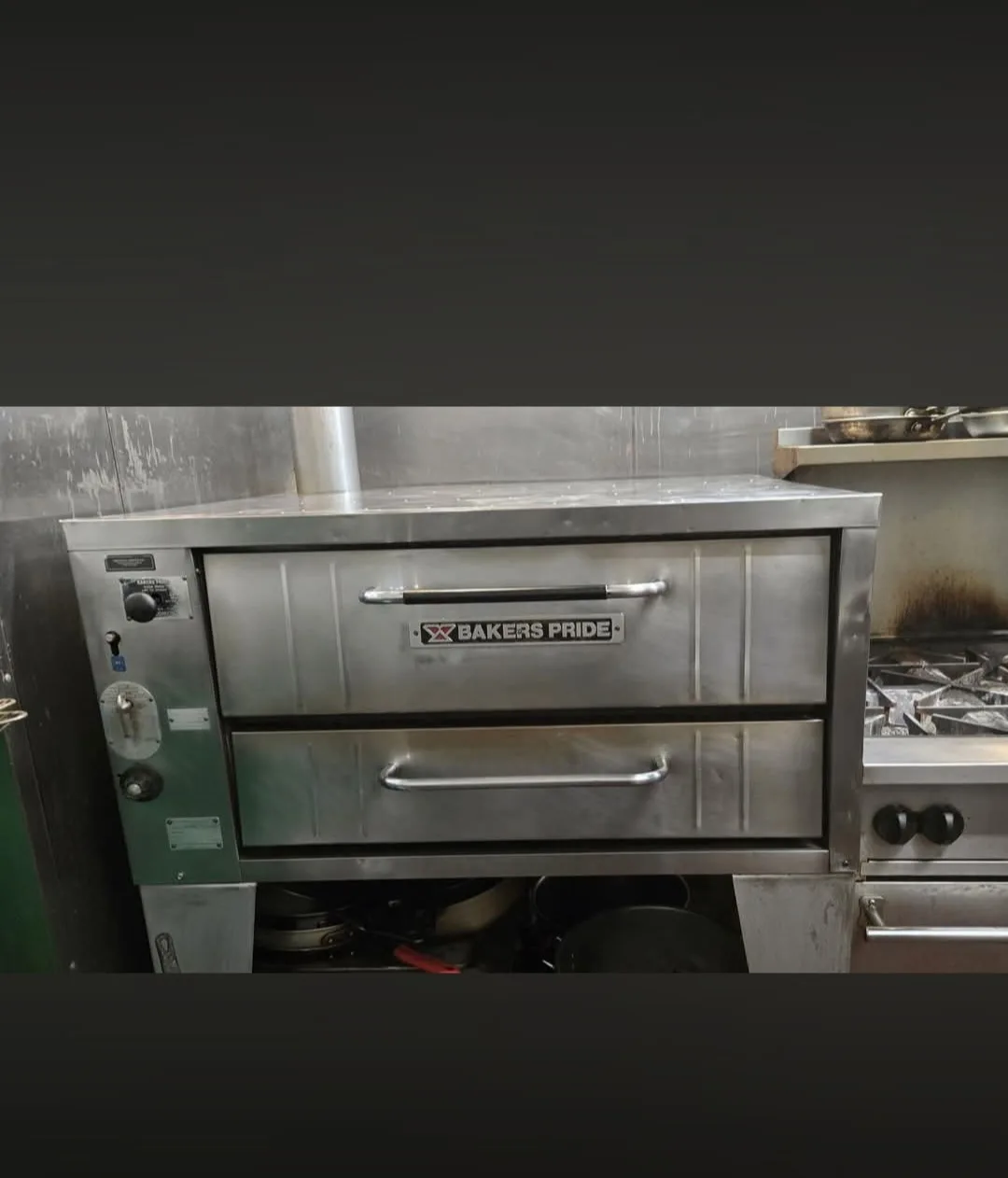 Commercial pizza oven after cleaning with carbon and grease removed from interior