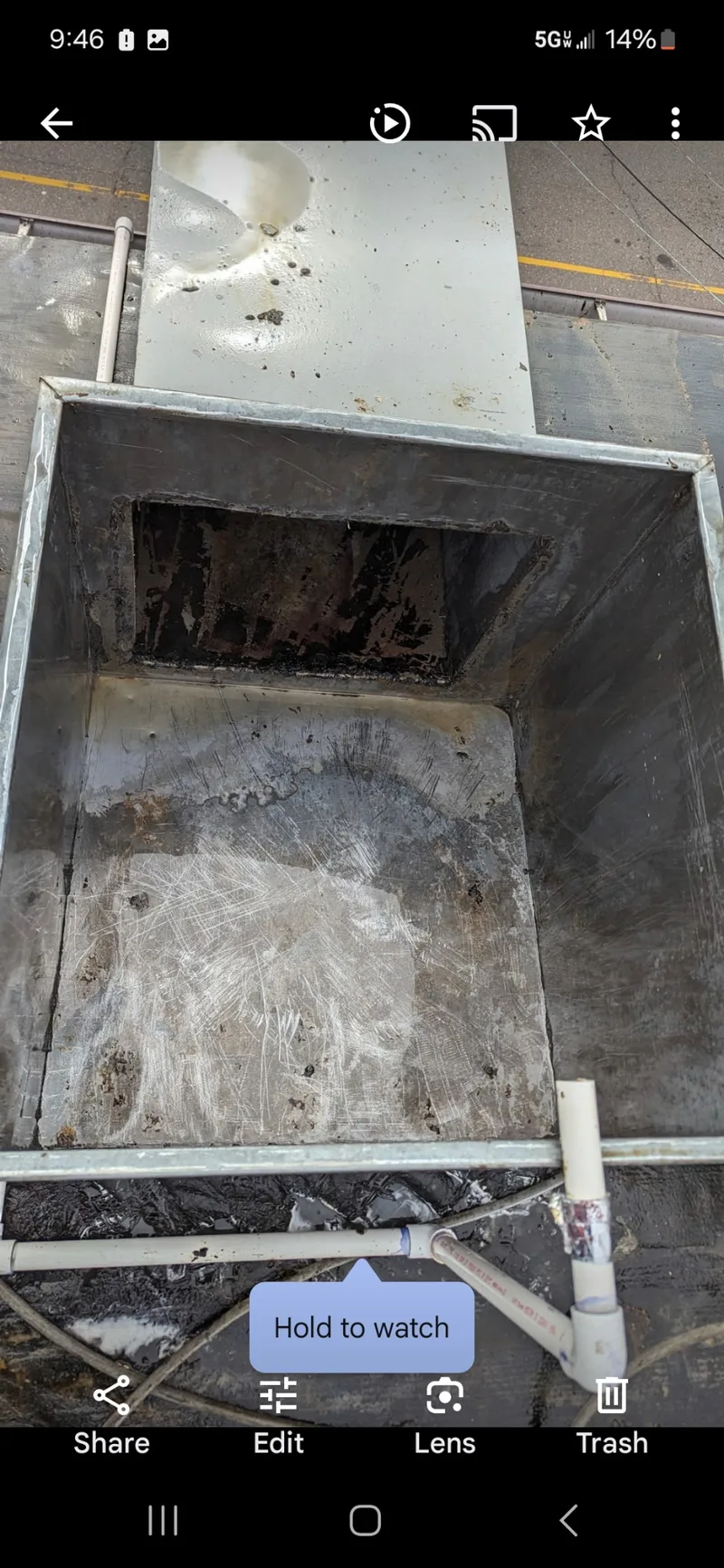 Same duct box after cleaning — grease fully removed