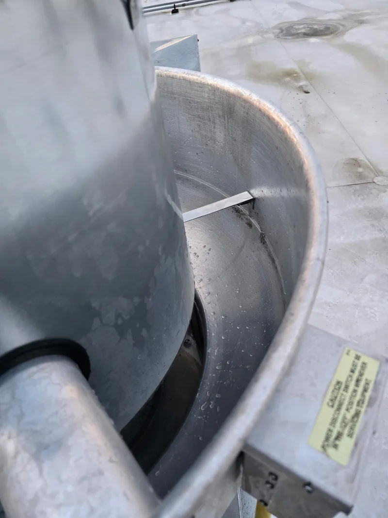 Exhaust fan after cleaning, restored to clean metal